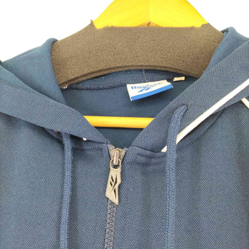 リーボック Reebok フロントロゴ刺繍 サイドライン パイピングデザイン ジップアップフーディ メンズ JPN:S