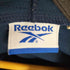 リーボック Reebok フロントロゴ刺繍 サイドライン パイピングデザイン ジップアップフーディ メンズ JPN:S
