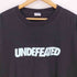 アンディフィーテッド UNDEFEATED フロントロゴプリント クルーネックTシャツ メンズ import:XL