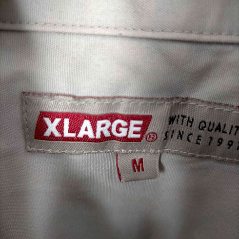 エクストララージ XLARGE 背面プリントS/Sポケットシャツ メンズ JPN:M