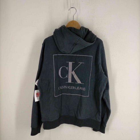 カルバンクラインジーンズ Calvin Klein Jeans ホログラムロゴプリントプルオーバーフーディー メンズ JPN:L