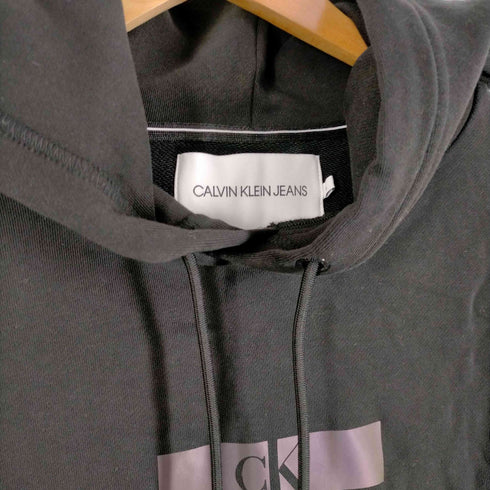 カルバンクラインジーンズ Calvin Klein Jeans ホログラムロゴプリントプルオーバーフーディー メンズ JPN:L