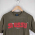 ステューシー Stussy 袖裾シングルステッチ MOVIN ON ロゴTシャツ メンズ JPN:M
