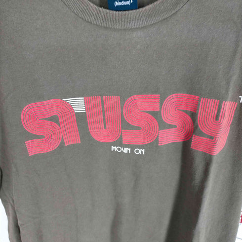 ステューシー Stussy 袖裾シングルステッチ MOVIN ON ロゴTシャツ メンズ JPN:M
