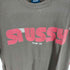 ステューシー Stussy 袖裾シングルステッチ MOVIN ON ロゴTシャツ メンズ JPN:M