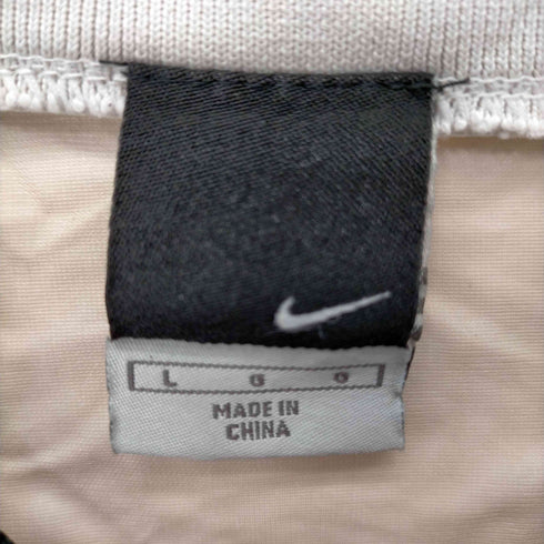 ナイキ NIKE 00S バックスウォッシュロゴ ウレタン加工ナイロンプルオーバー レディース import:L