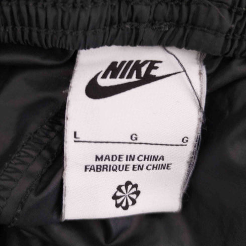 ナイキ NIKE ウーブン コア パンツ レディース JPN:L