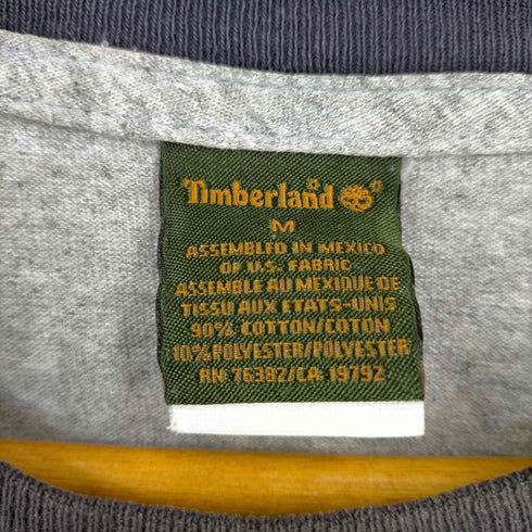 ティンバーランド Timberland 90-00S RUGGED&DURABLE フロントプリント霜降りTシャツ メンズ import:M