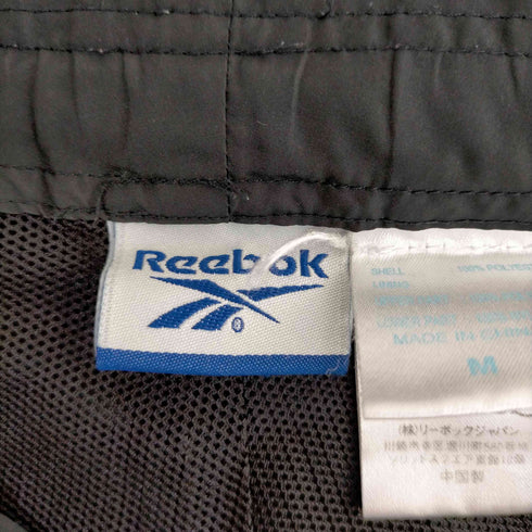 リーボック Reebok ダブルニーナイロンシェルパンツ メンズ JPN:M