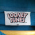 LOONEY TUNES 両面プリントクルーネックスウェット メンズ import:M
