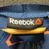 リーボック Reebok ワンシリーズ ムービングハイブリッド グラフィックスウェットフルジップフーディ ジップアップパーカー レディース JPN:L