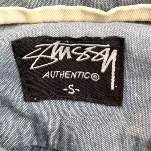 ステューシー Stussy 猫目ボタン ガチャポケ シャンブレーシャツ メンズ import:S