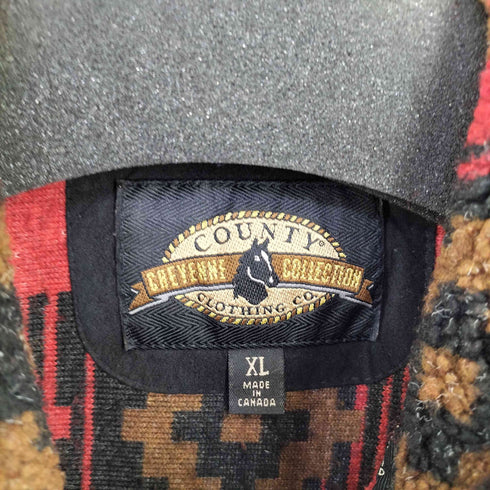 CHEYENNE COLLECTION MADE IN CANADA コンチョボタン ネイティブ柄ボアベスト レディース import:XL