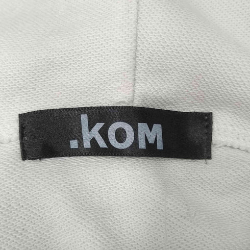 ドットコム .KOM カットオフ加工フロントプリントフーディー レディース