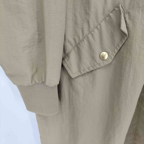 オムネス OMNES 撥水加工ナイロンノーカラー裾ドローコードブルゾン レディース