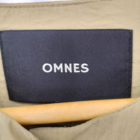 オムネス OMNES 撥水加工ナイロンノーカラー裾ドローコードブルゾン レディース