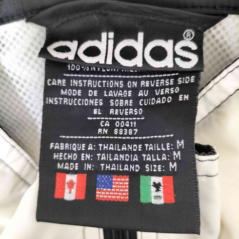 アディダス adidas 80S 万国旗タグ トレフォイルロゴ刺繍 サイドスリーストライプ パッカブルフード バイカラー ナイロンジャケット メンズ import:M