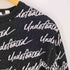アンディフィーテッド UNDEFEATED 総柄ロゴトレーナー メンズ