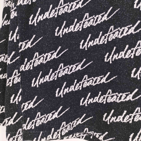 アンディフィーテッド UNDEFEATED 総柄ロゴトレーナー メンズ