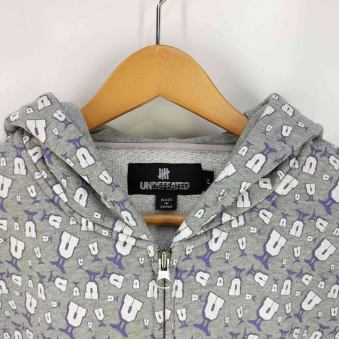 アンディフィーテッド UNDEFEATED 総柄 U-MAN ジップアップパーカー メンズ L