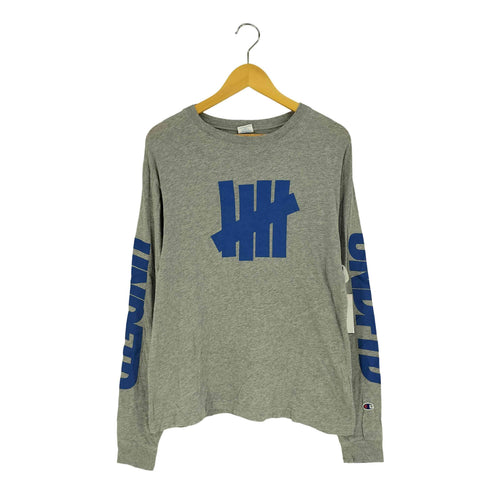 アンディフィーテッドチャンピオン UNDEFEATED CHAMPION プリントロゴ ロングスリーブカットソー メンズ M