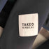 タケオキクチ TAKEO KIKUCHI ノーカラーボンディングジャケット メンズ