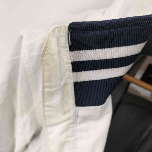 トミーヒルフィガー TOMMY HILFIGER ロゴ刺繍 フードパッカブルスタンドカラーブルゾン メンズ JPN:L