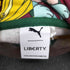 プーマ PUMA PRINTED HOODIE 総柄プリントパーカー レディース import:L