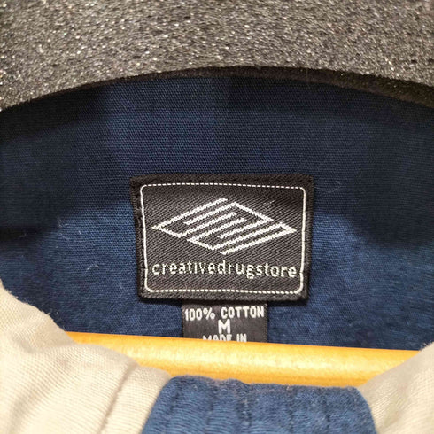 ボット BOTT CREATIVEDRUGSTORE 背面刺繍バイカラージップブルゾン 配色 ロゴ刺繍 裏地チェック メンズ JPN:M
