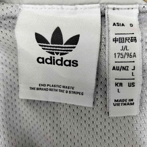 アディダスオリジナルス adidas Originals Oztradamus センターロゴ ハーフジップ ロゴ プリント サイドライン ウインド ブレーカー ジャージ レディース JPN:L