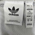 アディダスオリジナルス adidas Originals Oztradamus センターロゴ ハーフジップ ロゴ プリント サイドライン ウインド ブレーカー ジャージ レディース JPN:L