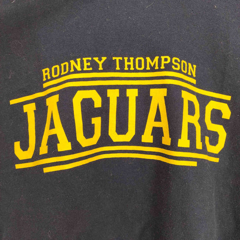 ギルダン GILDAN RUDNEY THOMPSON JAGUARS フロントプリントプルオーバーパーカー メンズ JPN:L