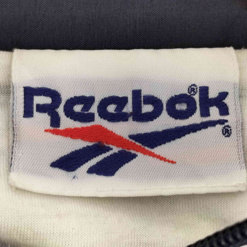 リーボック Reebok 90-00S 刺繍タグ 総柄 ジップアップナイロンジャケット メンズ