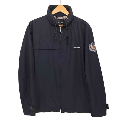 POKKA LABEL F1RST DRIP 袖ロゴワッペン 裏地チェック柄 ナイロンジャケット メンズ JPN:M