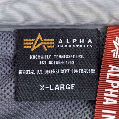 アルファインダストリーズ ALPHA INDUSTRIES OSHMANS別注 ウィンドECWCSジャケツト メンズ JPN:XL