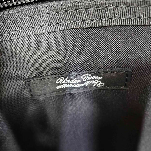 アンダーカバー UNDERCOVER WE MAKE NOISE NOT CLOTHES ナイロンバックパック マチレザー切替 メンズ