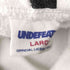 アンディフィーテッド UNDEFEATED NBA 総柄プルオーバーパーカー メンズ JPN:L