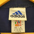 アディダス adidas 00S 国旗タグ ラバー パフォーマンスロゴ プリント プルオーバーパーカー レディース import:M