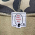 アベイシングエイプ A BATHING APE 90s 初期タグ 1stカモ カレッジロゴ プルオーバーパーカー メンズ JPN:L