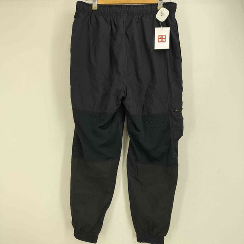 ナイキ NIKE STANDARD FIT メッシュ切り替え ナイロン ウィンドブレーカー ウーブンパンツ サイドポケット メンズ JPN:L