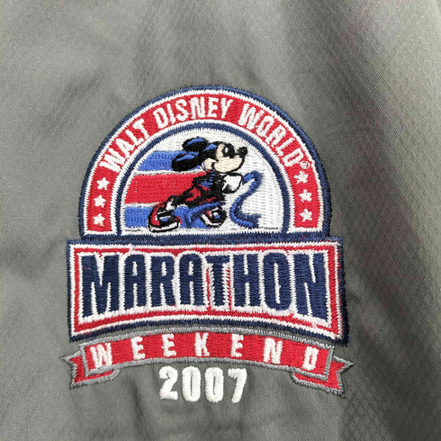 チャンピオン Champion キャラクターロゴ刺繍ナイロンハーフジップ メンズ L