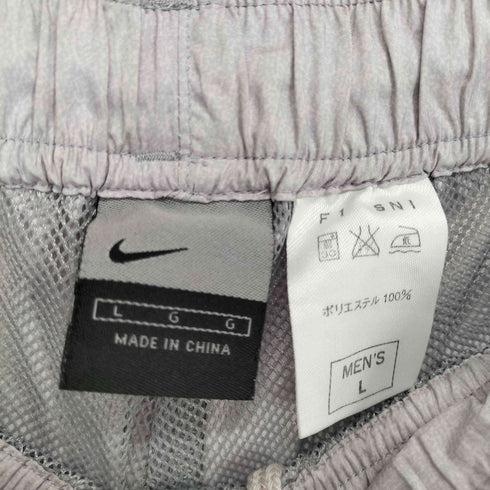 ナイキ NIKE スウッシュロゴ刺繍 サイドパイピング 裾ジップ トラックパンツ メンズ JPN:L