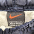 ナイキ NIKE 裾ジップポイントスウォッシュ刺繍ナイロンパンツ メンズ JPN:L