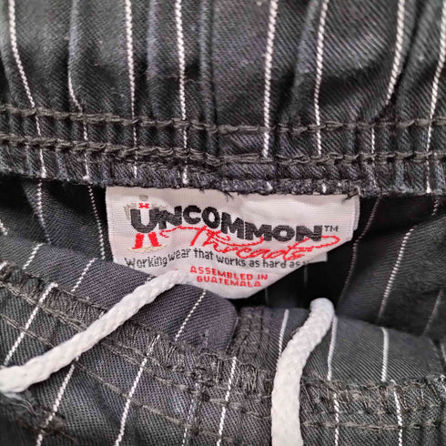 {[UNCOMMON ストライプイージーワイドパンツ メンズ