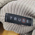 TRUBE 異素材切り替えニットフリルネック レディース