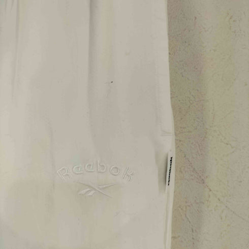 リーボック Reebok NAKEDコラボ ナイロンパンツ レディース JPN:M