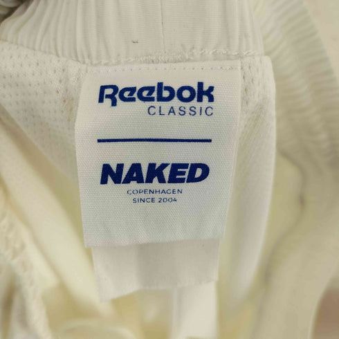 リーボック Reebok NAKEDコラボ ナイロンパンツ レディース JPN:M