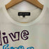 コムデギャルソン COMME des GARCONS live free with strong will プリント 半袖Tシャツ レディース JPN:S