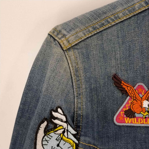 リー Lee バックキャラクターワッペントラッカージャケット レディース import:L