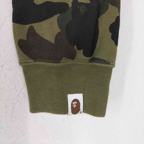 アベイシングエイプ A BATHING APE BAPE 1ST CAMO スワロフスキー プルオーバーパーカー レディース S